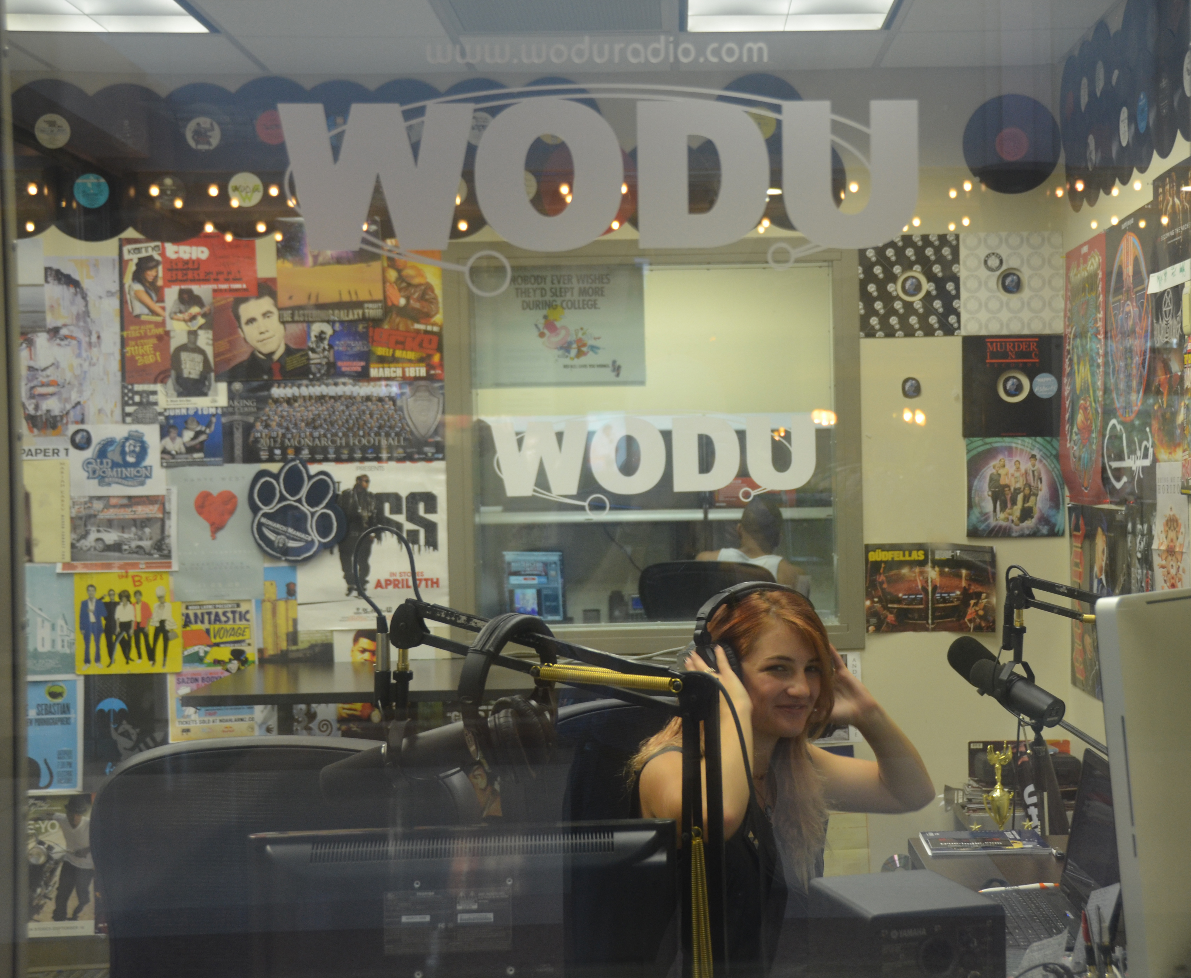 WODU Studios DJ Alex Motteler in the broadcasting booth. 