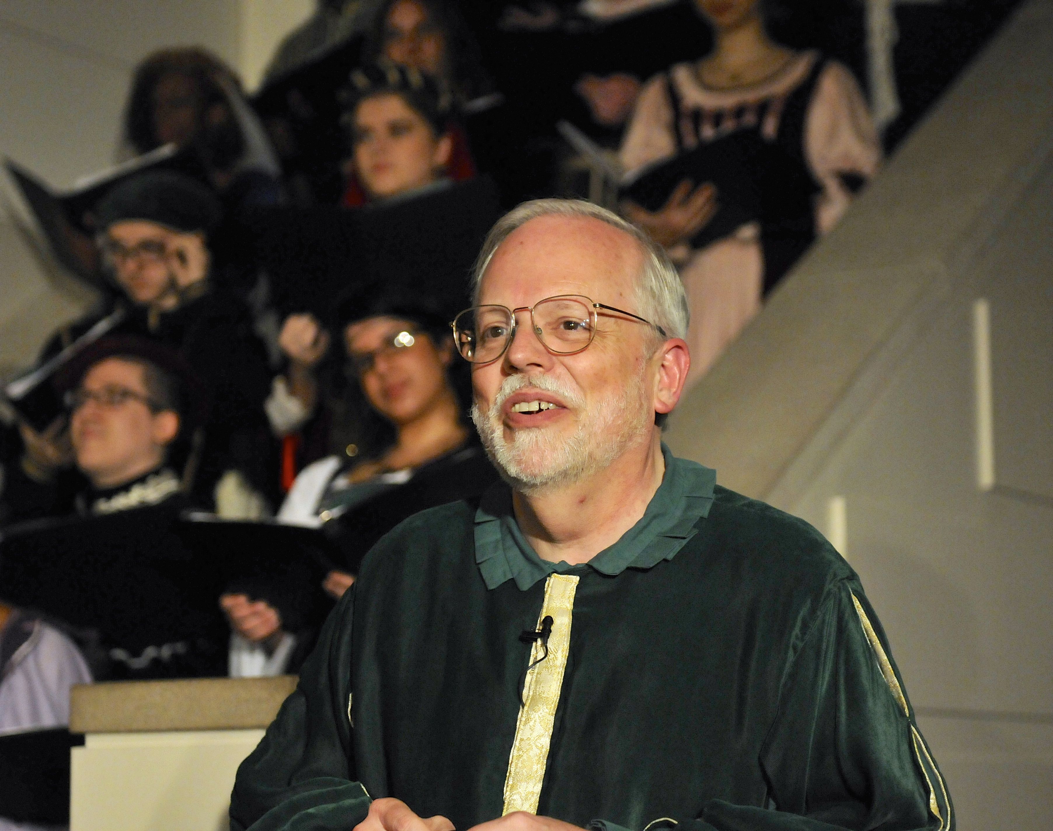 Photo of ODU Music faculty member Lee Teply leading Madrigal