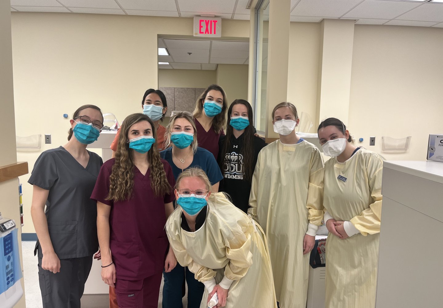 group of dental hygiene students posing for a photo 