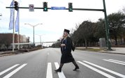 Graduate crosses Hampton Boulevard