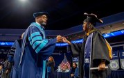 President Brian O. Hemphill, Ph.D., congratulates a student at Old Dominion University's commencement exercises on May 6 at Chartway Arena. Photo Chuck Thomas/ODU