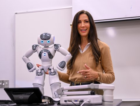 Helen Crompton holding robot