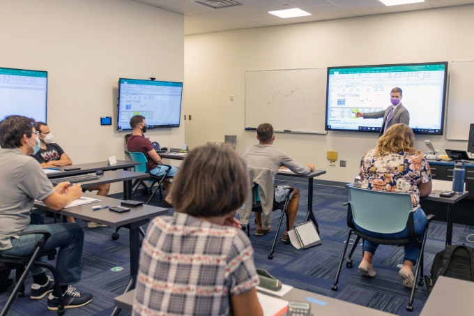 MBA instructor teaching in a classroom