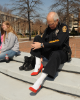 ODU police officer Mark Barrineau purchased an official pair of La Dame four inch red heels for the event. La Dame donates a percentage of each sale to the Walk a Mile organization. Photo Chuck Thomas/ODU