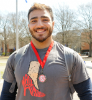 Wrestler Ali Wahab has been participating in Walk A Mile for three years and displays a medallion that is presented to participants who have walked multiple years. Photo Chuck Thomas/ODU