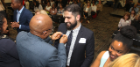 Provost Austin Agho pins Zhyar Abdul during the University’s annual First-Generation College Graduate Pinning Ceremony April 10 at Webb Center. Photo David B. Hollingsworth/ODU