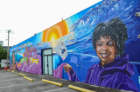Artists and community members came out Mother's Day Sunday to watch the unveiling of a 1500-square-foot mural on the exterior wall of the CHKD Thrift Store in Norfolk's NEON District. Photo Chuck Thomas/ODU