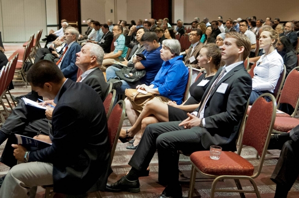 Audience members listen to a speaker at the International Association of Marine Economists (IAME) Conference 2014.