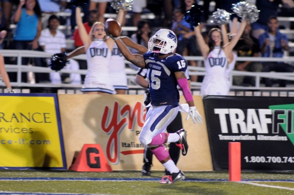 Senior Aaron Evans celebrates after returning a punt 64 yards to lead ODU&rsquo;s comeback win over Liberty on Saturday. The Monarchs trailed 17-7 with just over four minutes remaining when Evans caught the punt at the 36, went up the middle and burst outside untouched for the touchdown. The return set up Blair Roberts&rsquo; game-winning touchdown catch with 28 seconds remaining. It was the junior wide receiver&rsquo;s second TD reception of the game. Evans and Roberts earned national honors from the College Football Performance Awards. The Monarchs travel to Pittsburgh on Saturday, Oct. 19, for a 7 p.m. contest. The game will be broadcast on the ACC Network. Photo by Chuck Thomas