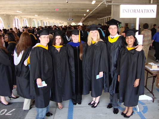 Physics masters students getting ready for commencement
