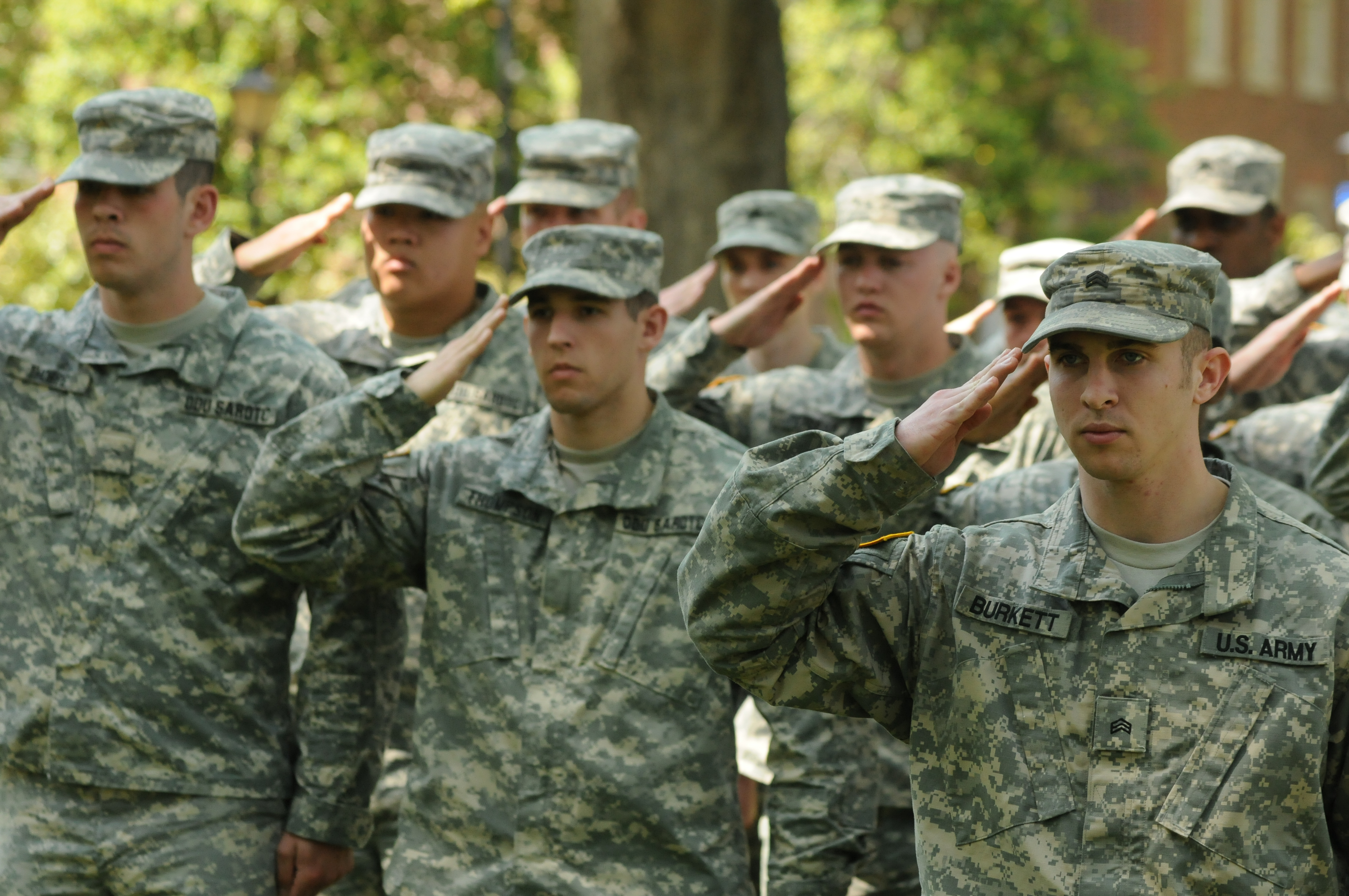 men in uniform saluting