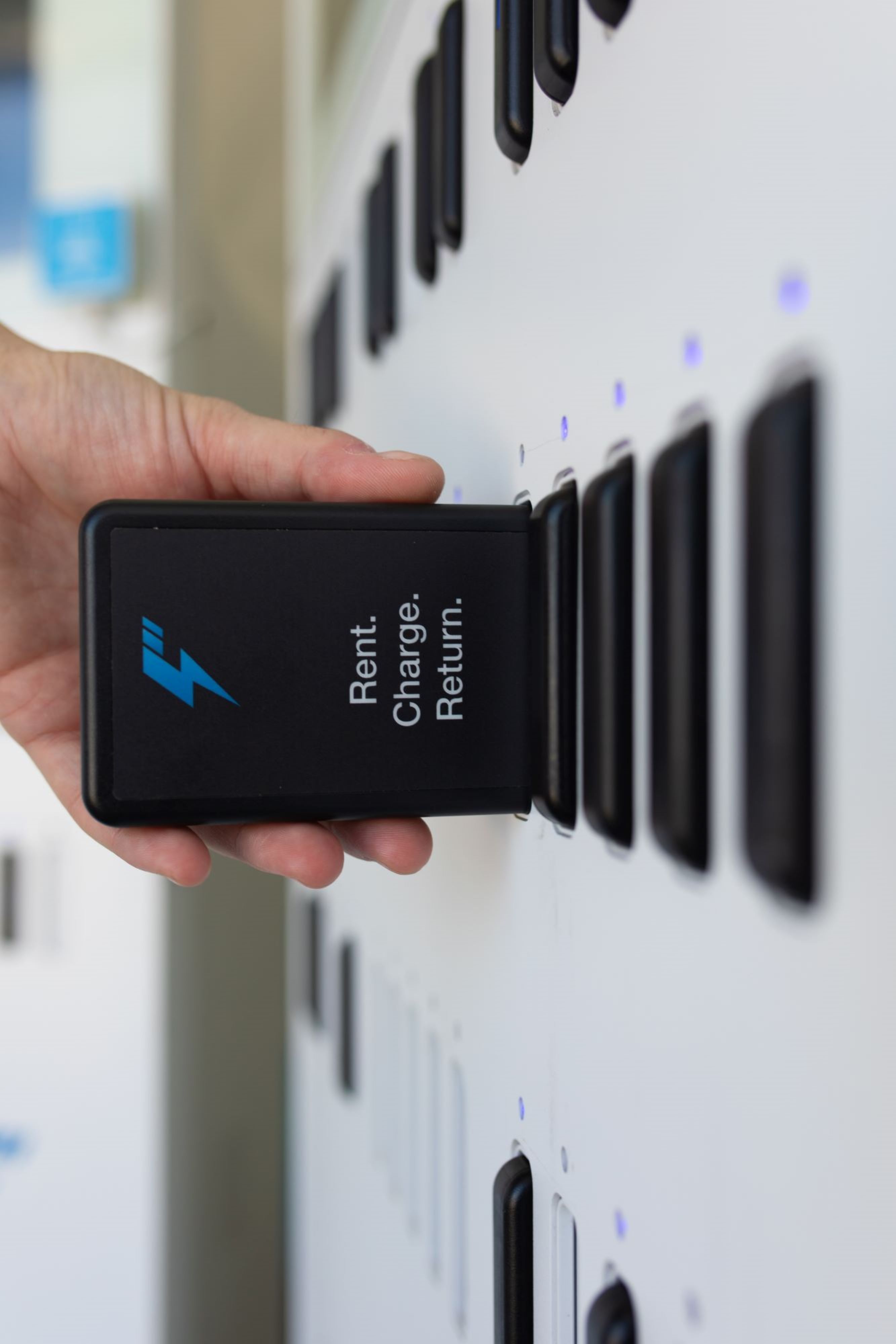 hand inserting battery into slot
