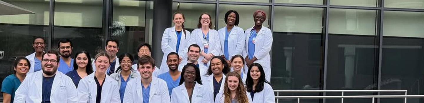 family med residents in front of a building
