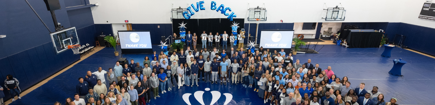 Group of ODU students take photo in celebration of the Monarchs Give Back 2024 campaign.