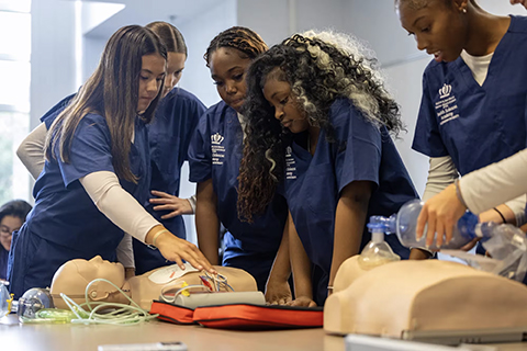 Health Sciences Academy students practicing CPR.