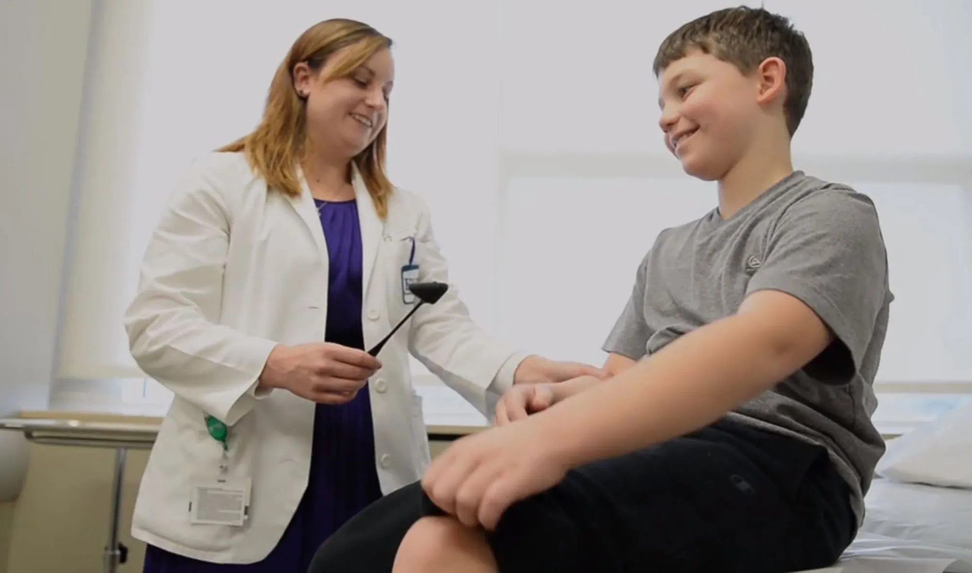 A fellow works with a 10-year-old standardized patient at EV