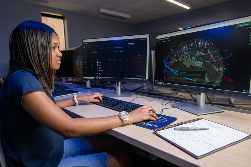 Student doing work on a computer.