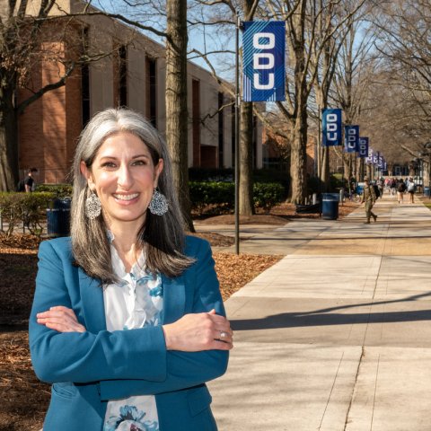 Krista Harrell stands in front of Kaufman Hall on the ODU campus.