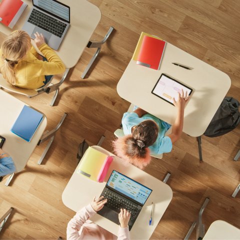 Students using mobile devices in a classroom