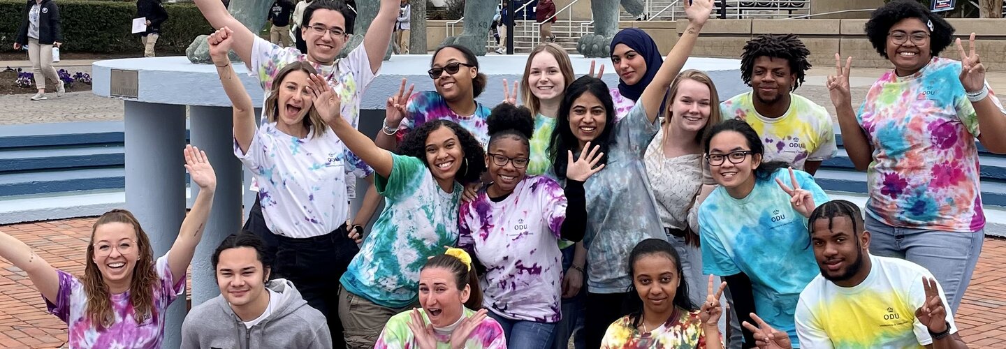 asb students in front of lion statue