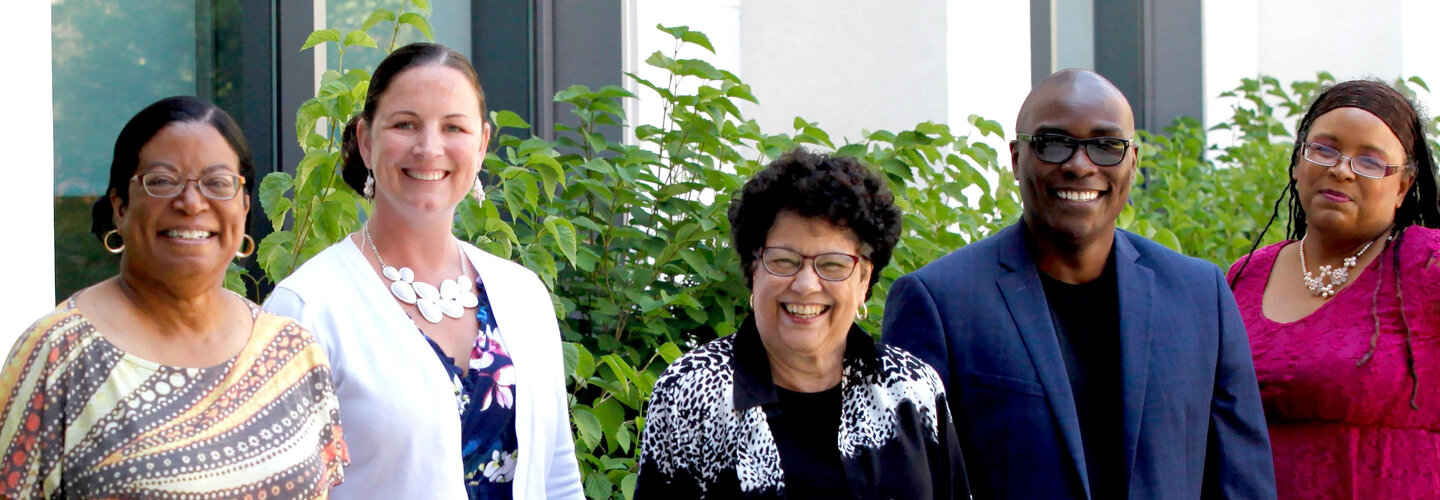 Group photo of diverse faculty