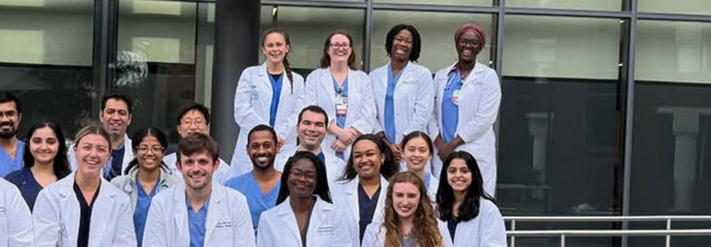 family med residents in front of a building