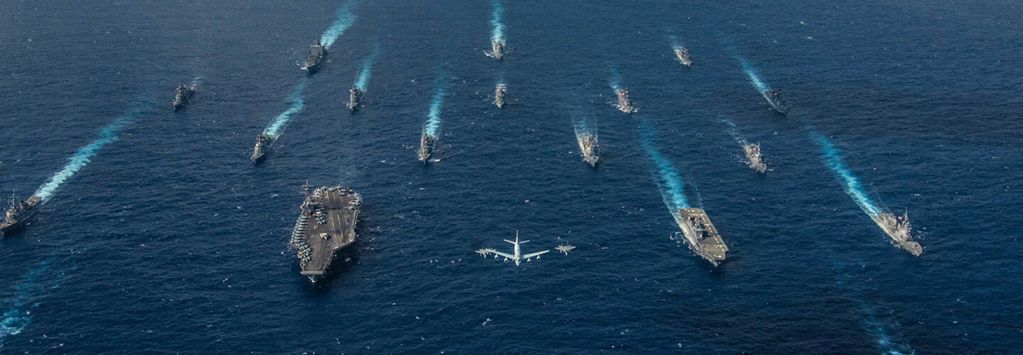 Battle group of Naval ships and planes