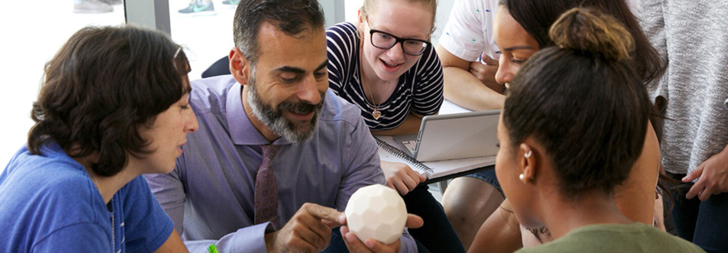 Professor Katsioloudis & ODU students work together in a classroom inside the new education building.