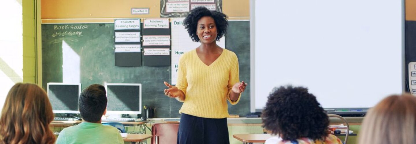 Teacher in classroom with students