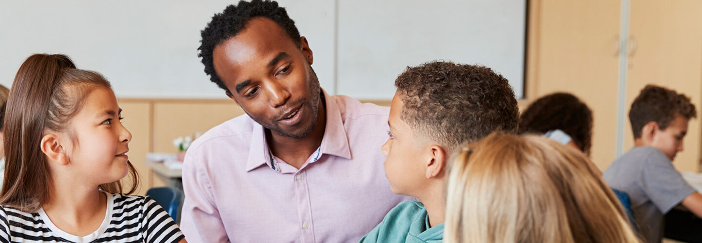 Teacher working with elementary students