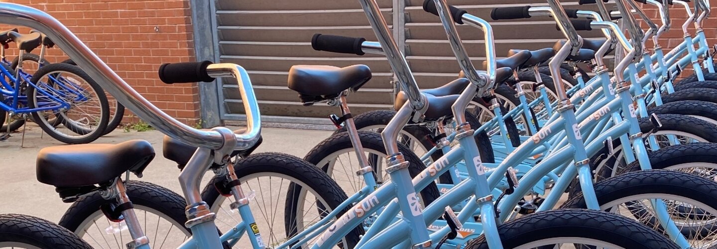 A row of bicycles in the blue color. 