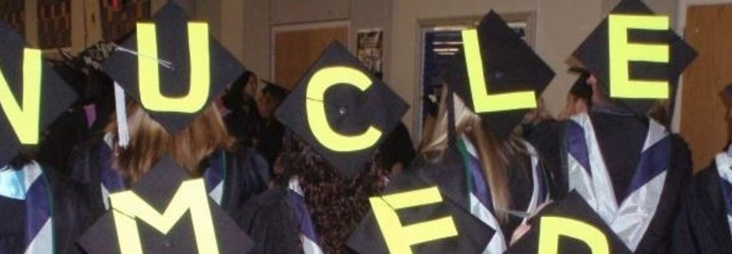 Group shot of graduates hat decor. 
