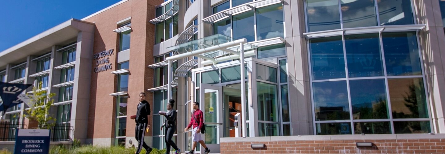 Students walking inside Broderick Dining Commons.