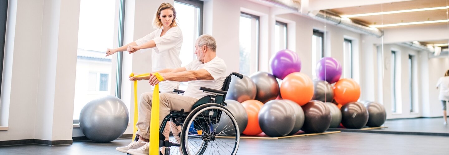 man in wheelchair doing yoga