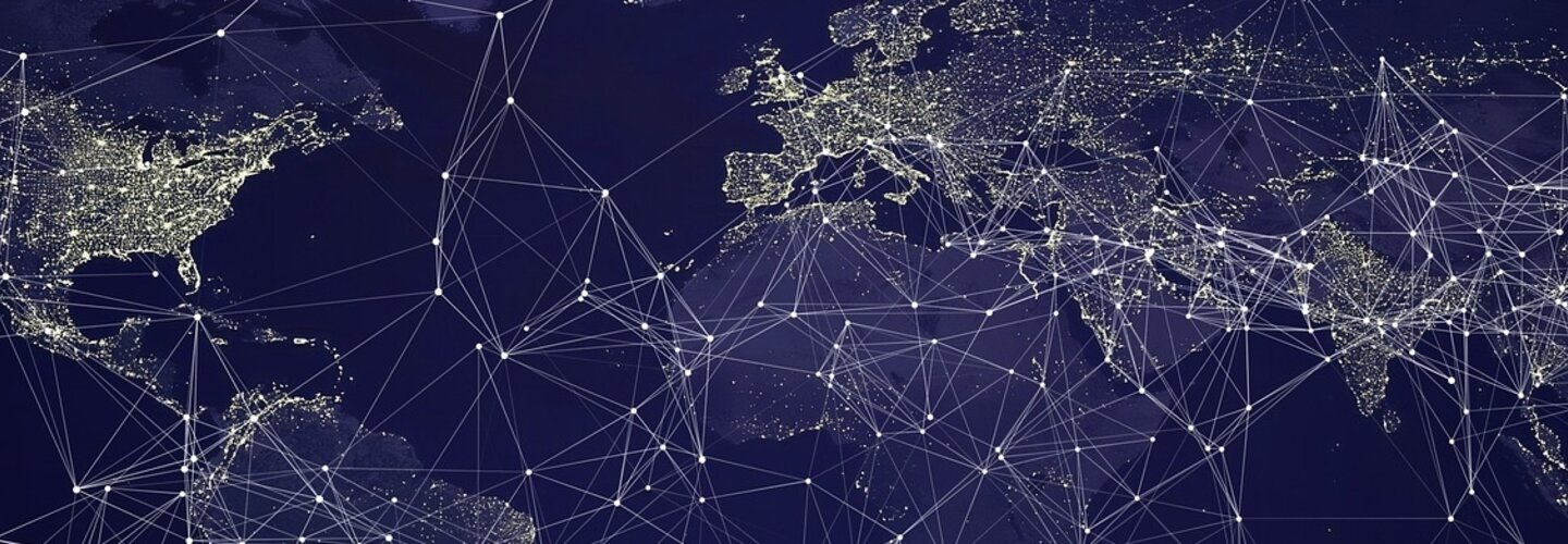 Map of world showing population centers lit up and lines indicating global network