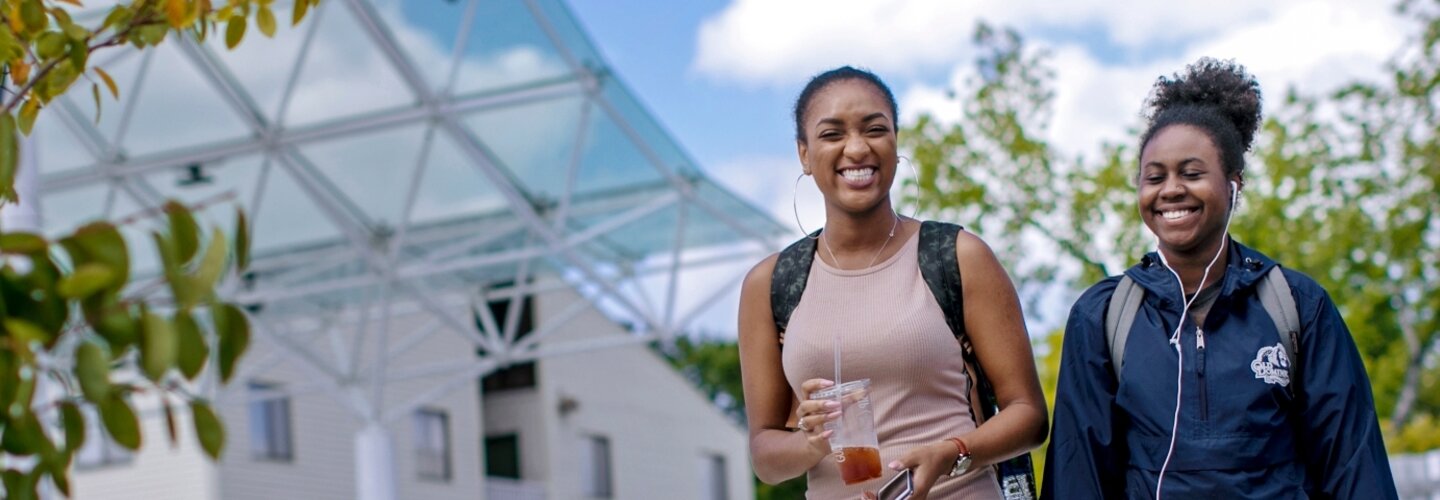 Students walking outside near Brock Commons.