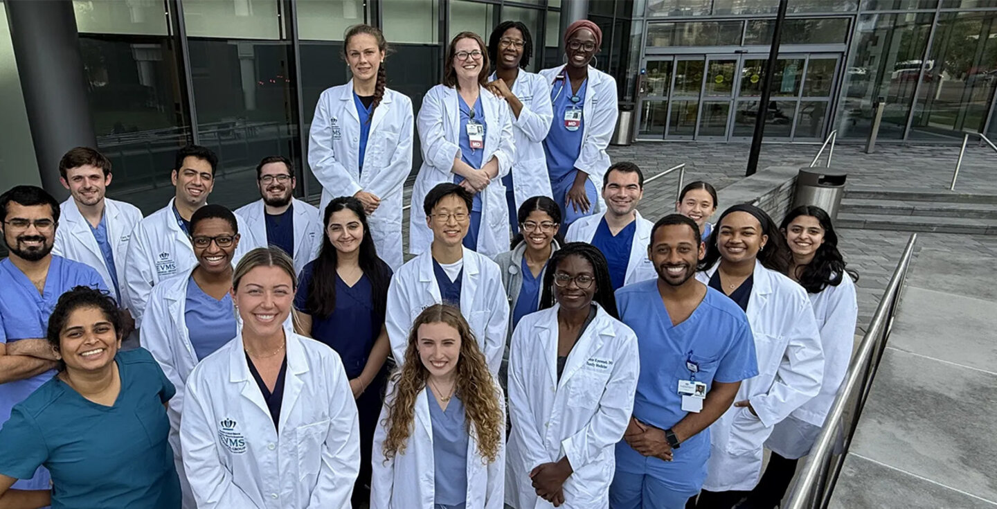 family med residents in front of a building