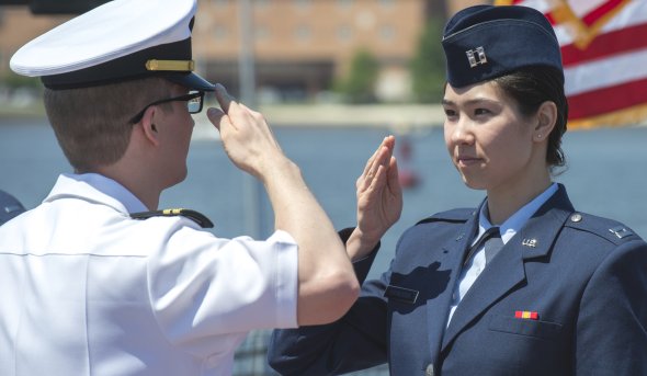 Military members salute each other