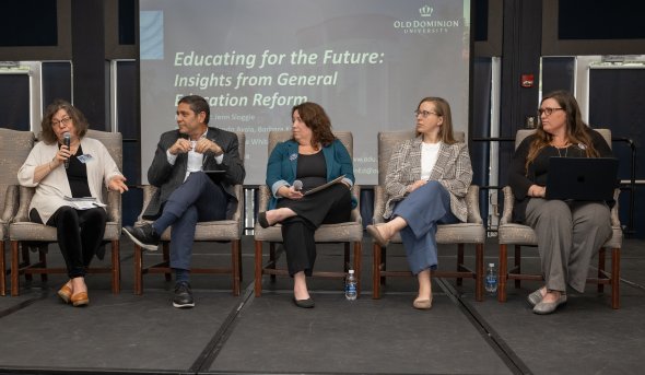 Group of people on stage for a panel