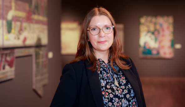 ODU alumnus Alison Byrne stands inside the Virginia Museum of Contemporary Art 
