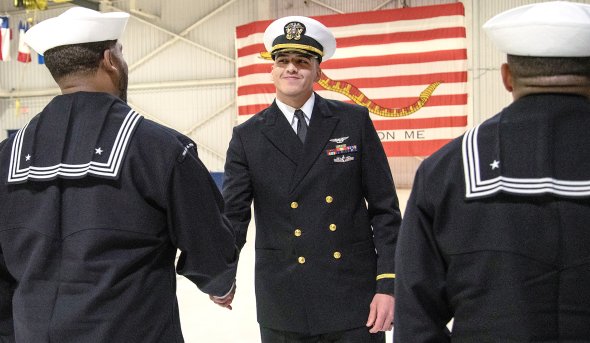 Juan Brambila shakes hands with someone.