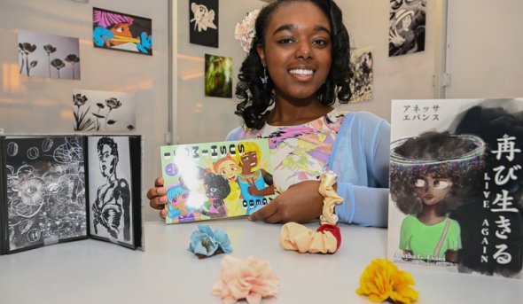A girl sitting at a table with blocks