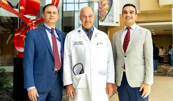 Dr. Rehan Qayyum, Dr. Raymond Benza and Dr. Amin Yehya in the Sentara Heart Hospital lobby.