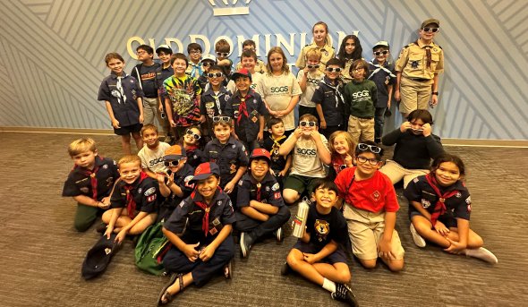 A group of cub scouts pose for a photo. 