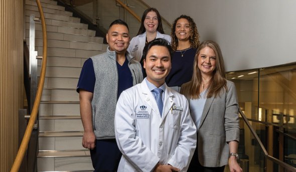 A group of people on a staircase.