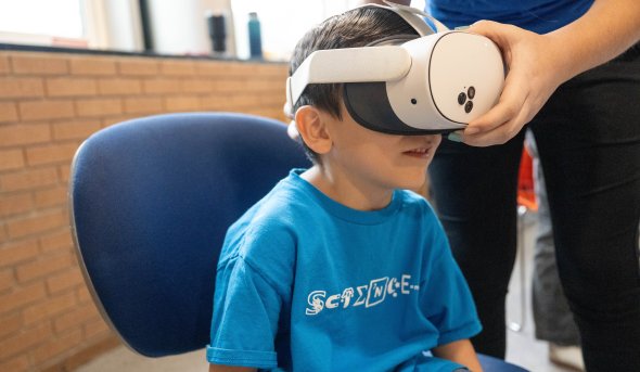 Young Student wears VR headset