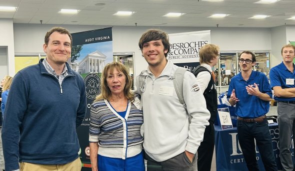student and business at career fair
