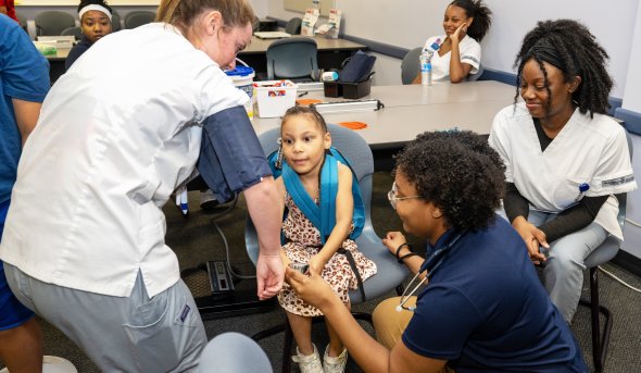 Child being serviced at health clinic
