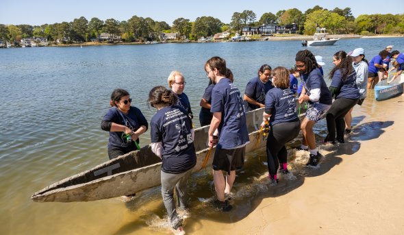 Team pulls concrete canoe to the water