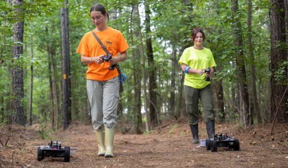 Two ODU students using tick bots.